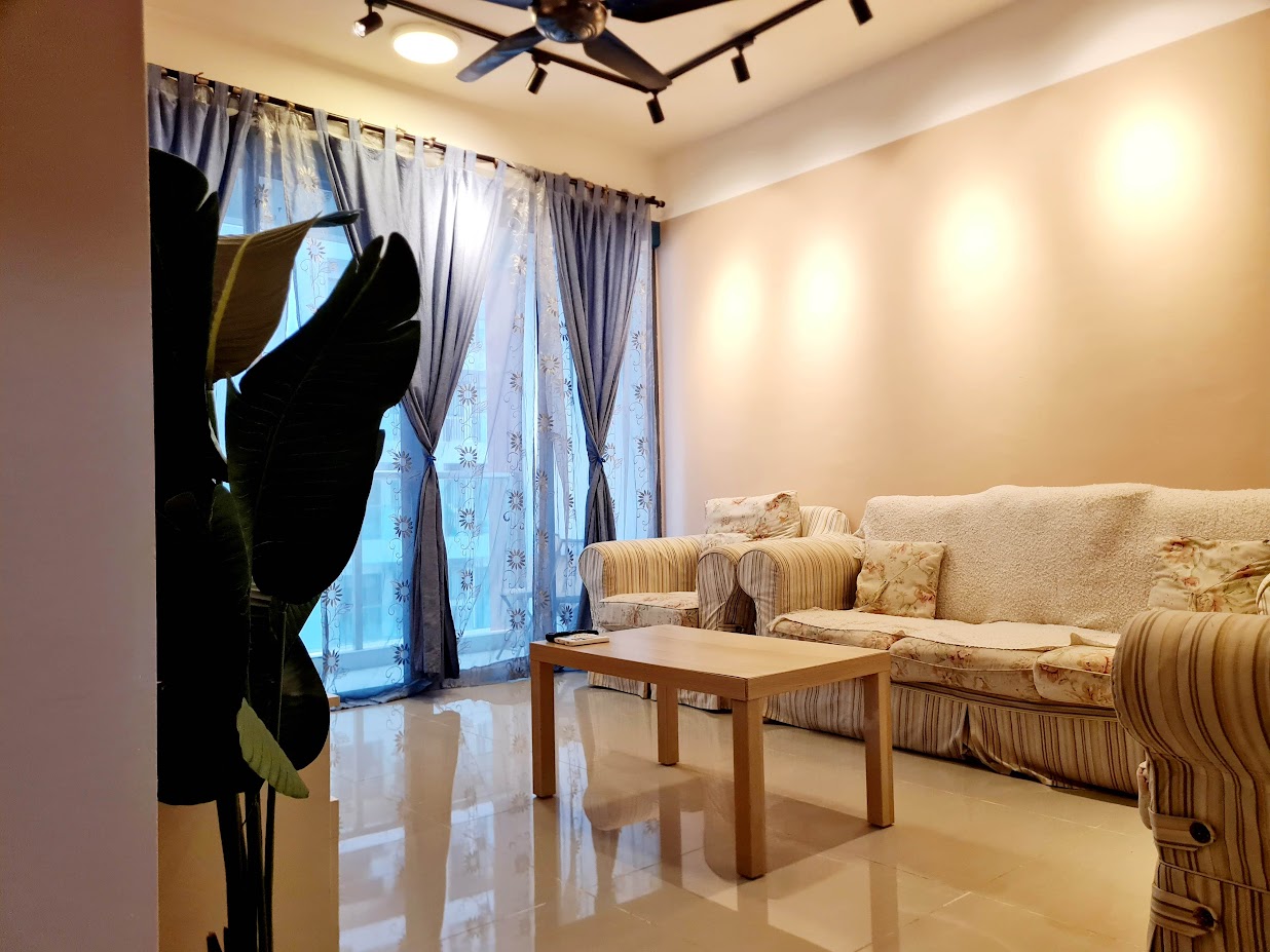 Living room detail with sofa and decorative blue wall